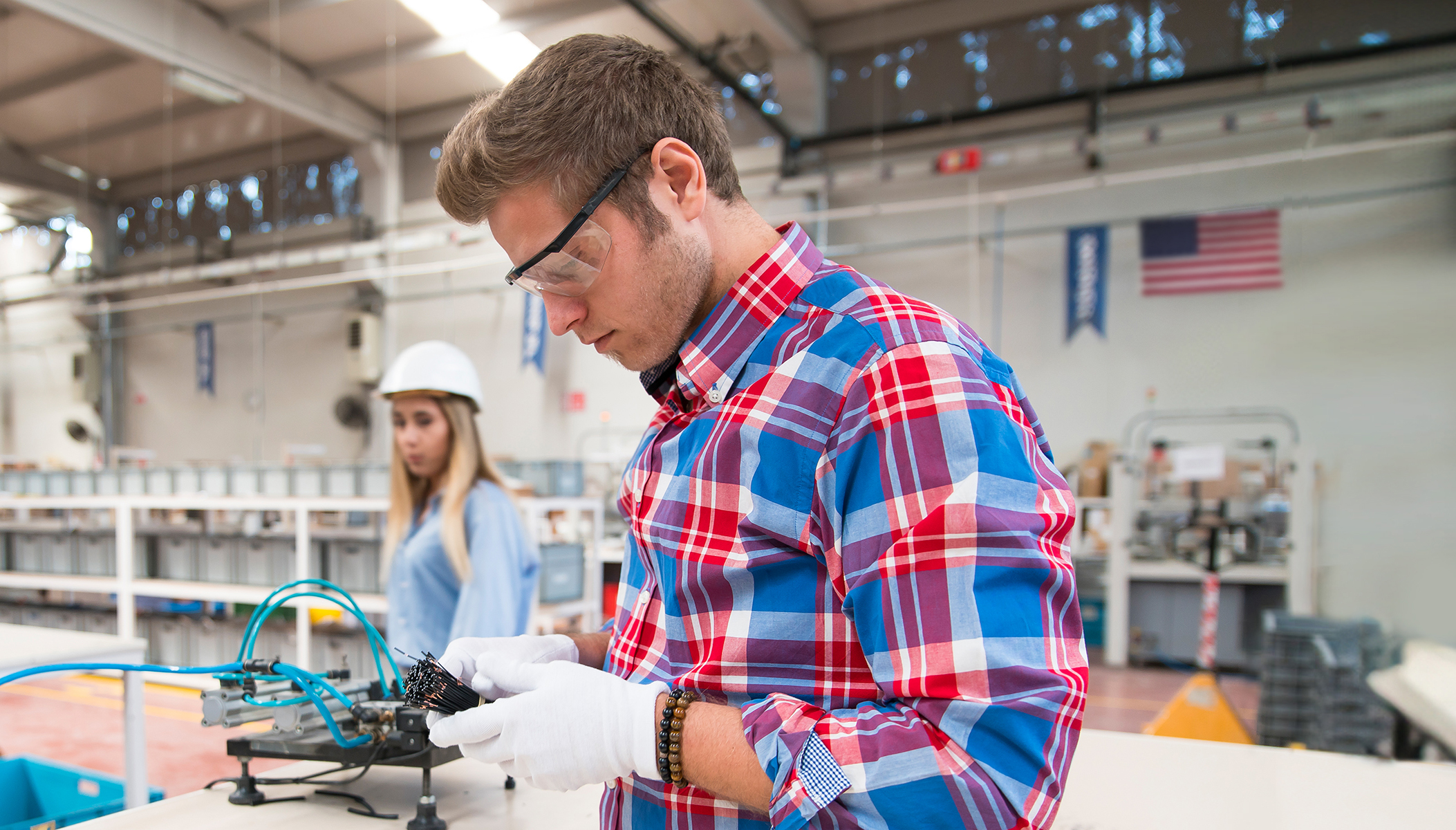 Young man and woman Working at Factory
