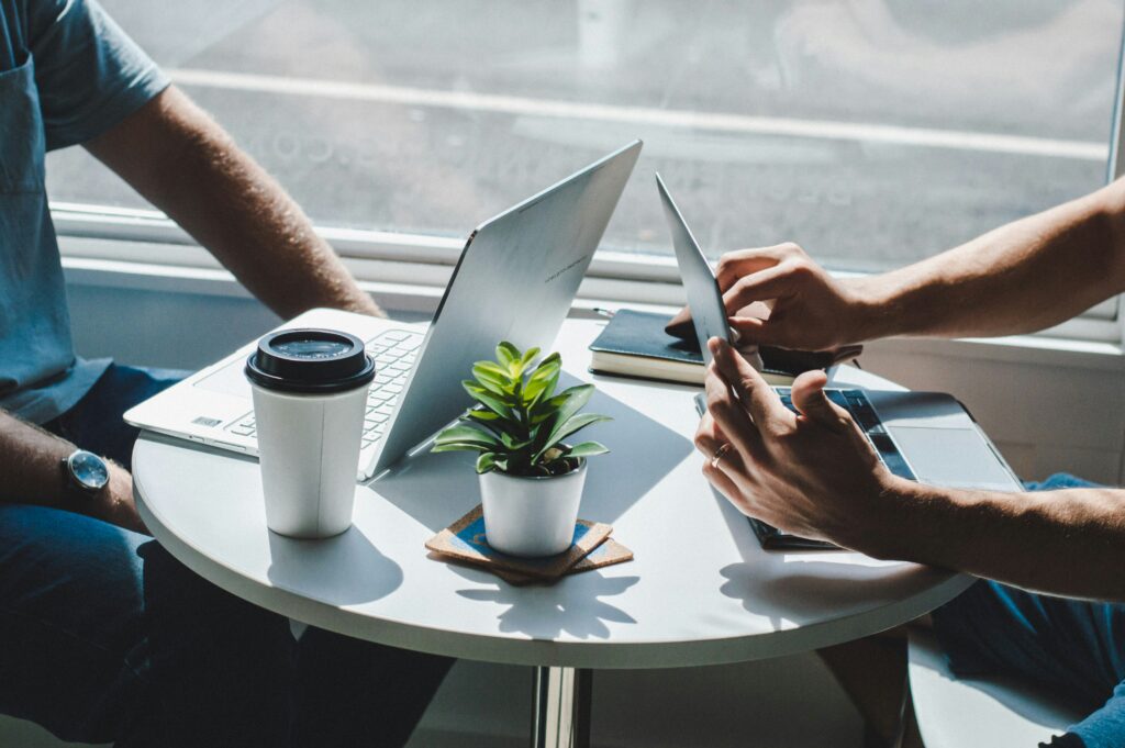 People on computers working on small business planning