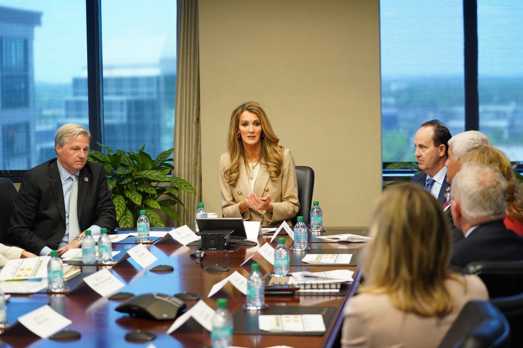 Administrator Loeffler sitting at a table meeting with loans program stakeholders along with other Small Business Administration leadership